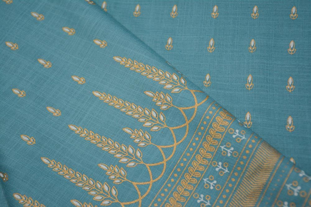 Sky Blue And Gold Print Slub Rayon Fabric